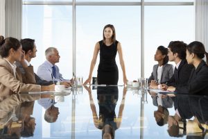 female CEO leading board meeting