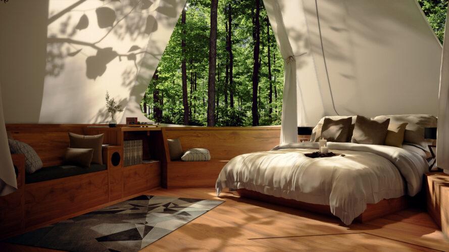 interior do projeto, com uma cama de casal, tapete e poltrona